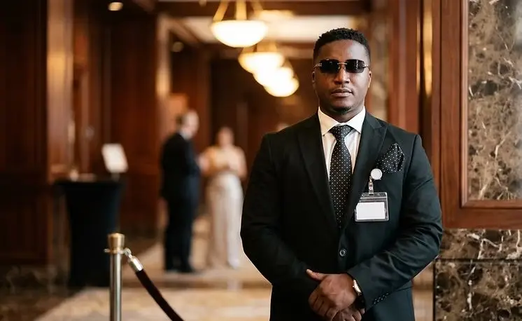 Concierge security guard in a suit in a lobby