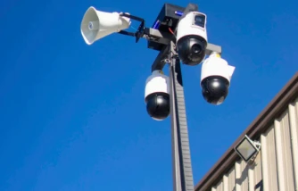 Camera mast with PTZ cameras and a horn speaker